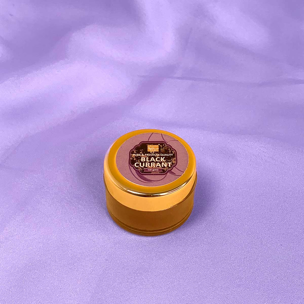 a yellow frisbee on a purple blanket 